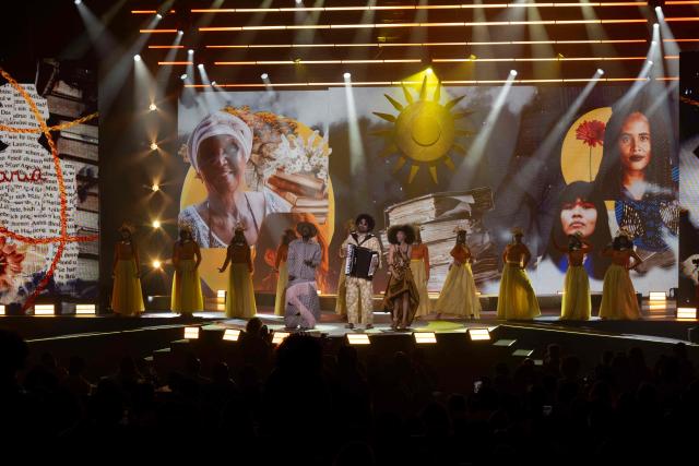 Brazilian singers Jota.pe, Mestrinho and Bruna Black perform during the Sim a Igualdade Racial Prize (Yes to Racial Equality Award) ceremony in Rio de Janeiro, Brazil on May 13, 2026. The event, organized by Instituto Identidades do Brazil, honors personalities and initiatives promoting racial equality in the country. (Photo by Pablo PORCIUNCULA / AFP)