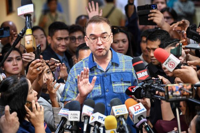 Philippine Senate President Alan Peter Cayetano speaks to members of the media inside the Senate building in Manila on May 14, 2026. Police said May 14 they detained a person in connection with gunfire the previous night inside the Philippine senate, where a lawmaker wanted by the International Criminal Court took refuge. (Photo by TED ALJIBE / AFP)