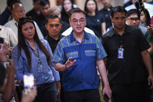 Philippine Senate President Alan Peter Cayetano speaks to members of the media inside the Senate building in Manila on May 14, 2026. Police said May 14 they detained a person in connection with gunfire the previous night inside the Philippine senate, where a lawmaker wanted by the International Criminal Court took refuge. (Photo by TED ALJIBE / AFP)