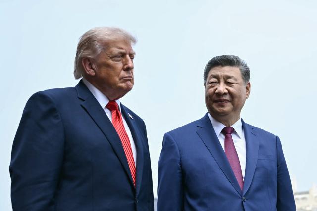 China's President Xi Jinping (R) and US President Donald Trump visit the Temple of Heaven in Beijing on May 14, 2026. Xi warned Trump that the issue of Taiwan could push their two countries into "conflict" if mishandled, a stark opening salvo as a superpower summit set to tackle numerous thorny issues began in Beijing on May 14. (Photo by Brendan SMIALOWSKI / POOL / AFP)