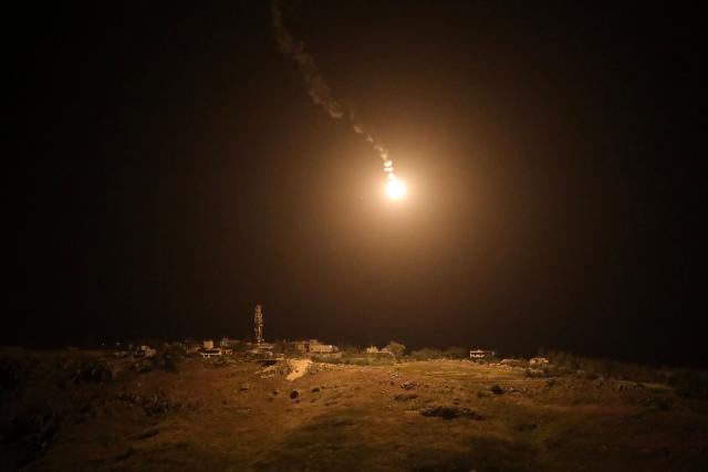 A photograph taken from the southern area of Marjayoun shows a flare fired by the Israeli military descending over the village of Arnoun late on May 13, 2026. Lebanon and Israel are to hold new peace talks in Washington starting on May 14, as their latest ceasefire -- considered to still be in place despite hundreds of deaths in Israeli strikes -- nears its end. On the eve of the negotiations, Lebanon's health ministry said that 22 people, including eight children, were killed on May 13 as Israel intensified airstrikes. (Photo by AFP)