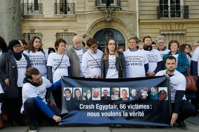 (FILES) Relatives of the victims from an EgyptAir plane that crashed into the Mediterranean in May 2016 hold a banner reading "Crash Egyptair, 66 victims : We want the truth" as they gather in front of the embassy of Egypt in Paris on May 19, 2017 on the day of the first anniversary of the accident. Ten years after the deaths of 66 people, including 15 French nationals, in the EgyptAir crash in the Mediterranean, the Paris public prosecutor's office has recommended that the case be dropped on the grounds that the investigation "has not identified any negligence other than that" of the crew members, all of whom died, AFP learned on May 14, 2026, from a source close to the case. (Photo by FRANCOIS GUILLOT / AFP)