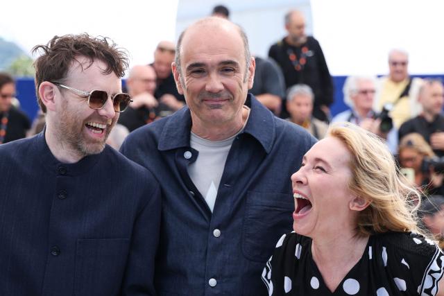 (FROM L) French actor Antoine Reinartz, French director and screenwriter Vincent Garenq and French actress Emmanuelle Bercot pose during a photocall of the film "L'Abandon" at the 79th edition of the Cannes Film Festival in Cannes, southern France on May 14, 2026. (Photo by Valery HACHE / AFP)