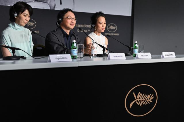 (FROM L) Japanese actress Takako Matsu, Japanese director and screenwriter Koji Fukada and Japanese actress Shizuka Ishibashi attend a press conference for the film "Nagi Notes" at the 79th edition of the Cannes Film Festival in Cannes, southern France on May 14, 2026. (Photo by Blanca Cruz / AFP)