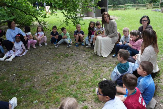 Britain's Catherine, Princess of Wales sits with children during her visits to the Salvador Allende preschool to observe how nature-based learning is embedded within the Reggio Emilia approach, part of a two-day trip, in Reggio Emilia, Italy, on May 14, 2026. Established in 1996, REMIDA is a cultural project dedicated to sustainability, creativity and the re use of industrial surplus. (Photo by Antonio Calanni / POOL / AFP)