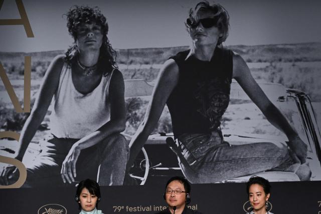 (FROM L) Japanese actress Takako Matsu, Japanese director and screenwriter Koji Fukada and Japanese actress Shizuka Ishibashi attend a press conference for the film "Nagi Notes" at the 79th edition of the Cannes Film Festival in Cannes, southern France on May 14, 2026. (Photo by Blanca Cruz / AFP)