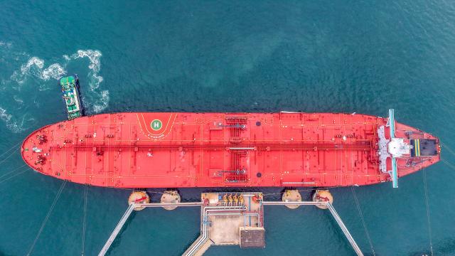 This aerial photo shows a tanker unloading imported crude oil at a terminal port in Qingdao, in China’s eastern Shandong province on May 14, 2026. (Photo by CN-STR / AFP) / China OUT