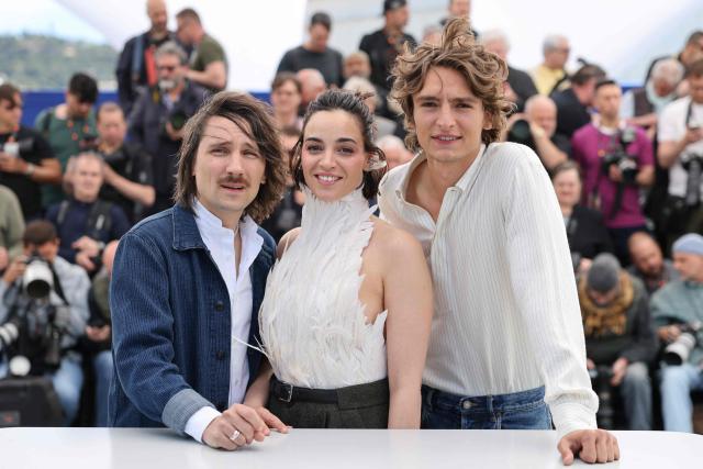 (FROM L) French director Berenger Thouin, Swiss actress Souheila Yacoub and Canadian actor Vassili Schneider pose during a photocall of the film "L’Age d'Or" (The Golden Age) at the 79th edition of the Cannes Film Festival in Cannes, southern France on May 14, 2026. (Photo by Thibaud MORITZ / AFP)