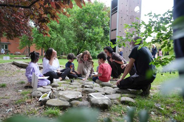 Britain's Catherine, Princess of Wales, meets with children as she visits the Salvador Allende preschool to observe how nature-based learning is embedded within the Reggio Emilia approach, part of a two-day trip, in Reggio Emilia, Italy, on May 14, 2026. (Photo by Antonio Calanni / POOL / AFP)