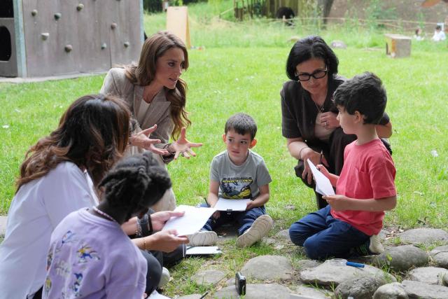 Britain's Catherine, Princess of Wales, meets with children as she visits the Salvador Allende preschool to observe how nature-based learning is embedded within the Reggio Emilia approach, part of a two-day trip, in Reggio Emilia, Italy, on May 14, 2026. (Photo by Antonio Calanni / POOL / AFP)