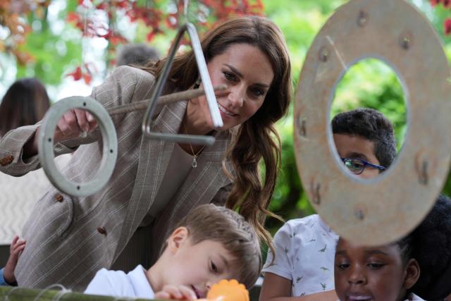 Britain's Catherine, Princess of Wales, meets with children as she visits the Salvador Allende preschool to observe how nature-based learning is embedded within the Reggio Emilia approach, part of a two-day trip, in Reggio Emilia, Italy, on May 14, 2026. (Photo by Antonio Calanni / POOL / AFP)