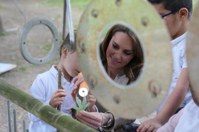 Britain's Catherine, Princess of Wales, meets with children as she visits the Salvador Allende preschool to observe how nature-based learning is embedded within the Reggio Emilia approach, part of a two-day trip, in Reggio Emilia, Italy, on May 14, 2026. (Photo by Antonio Calanni / POOL / AFP)