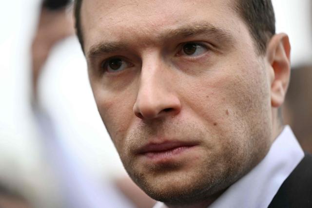 French far-right party Rassemblement National (RN) president Jordan Bardella looks on during a visit in Beaucaire, southern France on May 14, 2026. (Photo by Gabriel BOUYS / AFP)