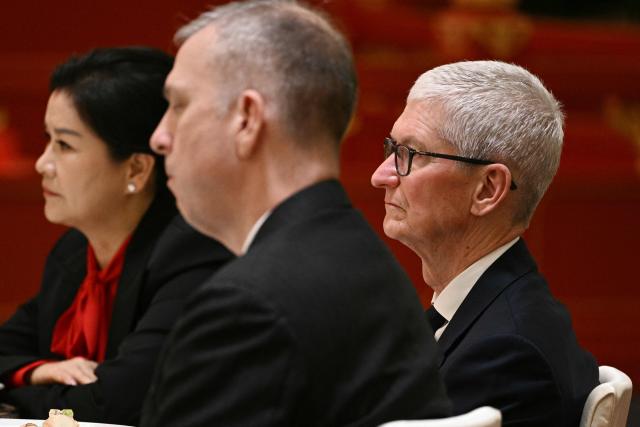 Apple CEO Tim Cook attends a state banquet for US President Donald Trump and China's President Xi Jinping at the Great Hall of the People in Beijing on May 14, 2026. (Photo by Brendan SMIALOWSKI / AFP)