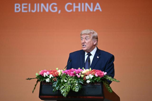 US President Donald Trump makes a speech as he attends a state banquet with China's President Xi Jinping at the Great Hall of the People in Beijing on May 14, 2026. (Photo by Brendan SMIALOWSKI / AFP)