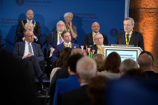 The former President of the European Central Bank (ECB) and former Italian Prime Minister Mario Draghi (R) gives a speech as he is awarded the 2026 International Charlemagne Prize of Aachen, on May 14, 2026 in Aachen, western Germany. (Photo by Sascha Schuermann / AFP)