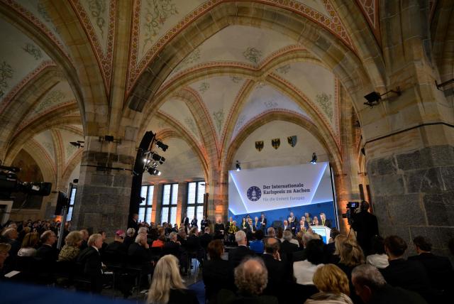 The former President of the European Central Bank (ECB) and former Italian Prime Minister Mario Draghi (R) gives a speech as he is awarded the 2026 International Charlemagne Prize of Aachen, on May 14, 2026 in Aachen, western Germany. (Photo by Sascha Schuermann / AFP)