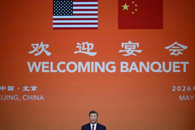 China's President Xi Jinping makes a speech during a state banquet for US President Donald Trump at the Great Hall of the People in Beijing on May 14, 2026. (Photo by Brendan SMIALOWSKI / AFP)