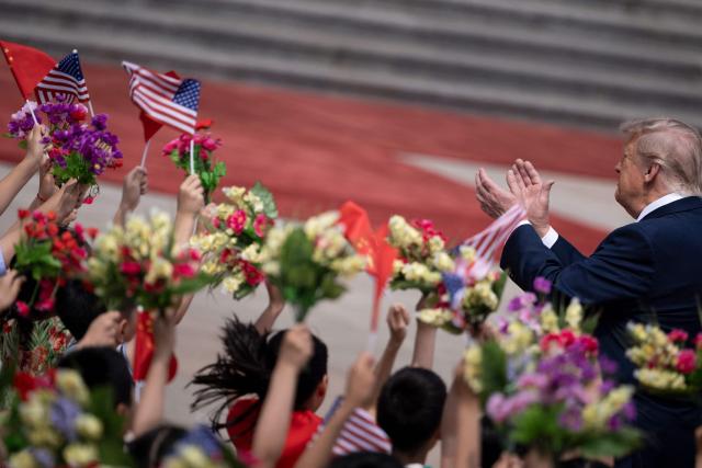 Children greet US President Donald J. Trump during a ceremony with China's President Xi Jinping before a meeting at the Great Hall of the People in Beijing on May 14, 2026. (Photo by Brendan Smialowski / AFP)