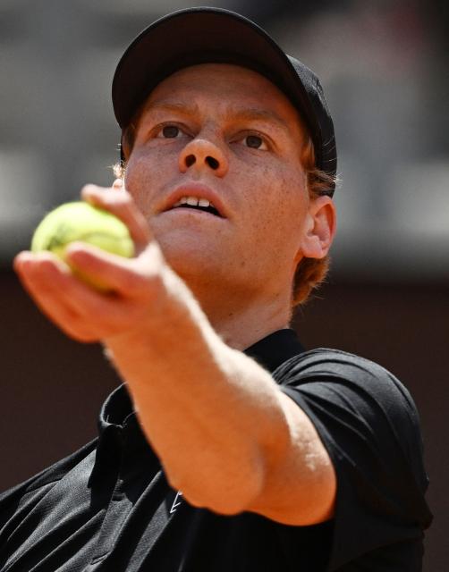 Italy's Jannik Sinner serves to Russia's Andrey Rublev during the ATP Rome Open tennis tournament at Foro Italico in Rome on May 14, 2026. (Photo by Tiziana FABI / AFP)