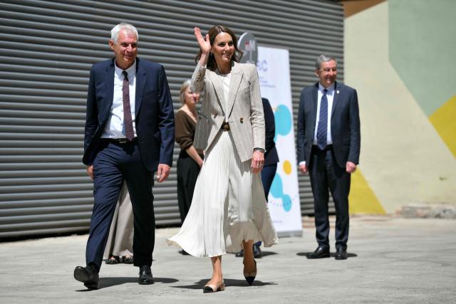 TOPSHOT - Britain's Catherine, Princess of Wales, visits REMIDA, Reggio Emilia’s creative resource centre, to learn how local businesses and the wider community support early childhood education through the Reggio Emilia Approach, on May 14, 2026. Established in 1996, REMIDA is a cultural project dedicated to sustainability, creativity and the re use of industrial surplus. (Photo by Marco BERTORELLO / POOL / AFP)