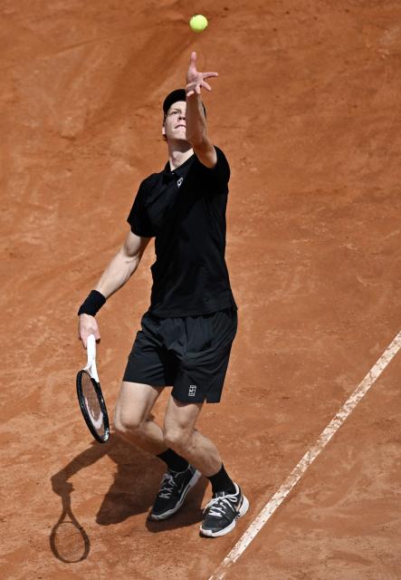 Italy's Jannik Sinner serves to Russia's Andrey Rublev during the ATP Rome Open tennis tournament at Foro Italico in Rome on May 14, 2026. (Photo by Tiziana FABI / AFP)