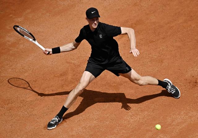 Italy's Jannik Sinner hits a return to Russia's Andrey Rublev during the ATP Rome Open tennis tournament at Foro Italico in Rome on May 14, 2026. (Photo by Tiziana FABI / AFP)