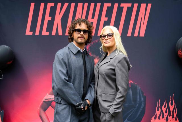 Finnish singers Linda Lampenius (R) and Pete Parkkonen, representing Finland with the song 'Liekinheitin' pose during an interview on the sidelines of the Eurovision Song Contest 2026 (ESC) in Vienna, Austria on May 14, 2026, before the second semi-final of the contest. (Photo by MAX SLOVENCIK / APA / AFP) / Austria OUT