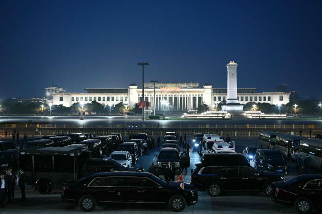 US President Donald Trump's motorcade waits outside the Great Hall of the People as Trump and China's President Xi Jinping attend a state banquet in Beijing on May 14, 2026. (Photo by Brendan SMIALOWSKI / AFP)