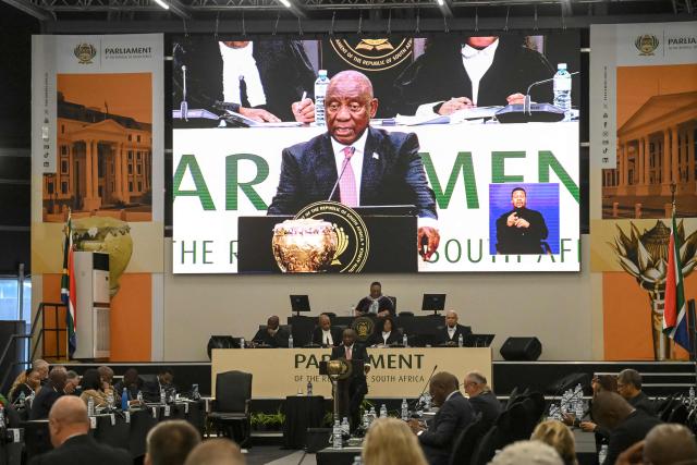 South Africa's President Cyril Ramaphosa (C) answers questions in Parliament in Cape Town on May 14, 2026. (Photo by RODGER BOSCH / AFP)