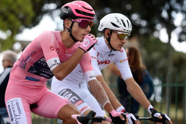 Pink jersey, Bahrain - Victorious Portuguese rider Afonso Eulalio takes the start of the 6th stage of the Giro d'Italia 2026 - Tour of Italy cycling race between Paestum and Napoli, Italy, on May 14, 2026. (Photo by Luca Bettini / AFP)