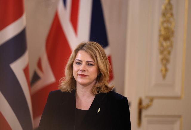 (FILES) Latvian Prime Minister Evika Silina arrives to attend the Joint Expeditionary Force JEF Leaders Summit in Helsinki, Finland on March 26, 2026. Latvia's Prime Minister Evika Silina told a press conference on May 14, 2026 she had resigned over her government's handling of Ukrainian drones that strayed into Latvian territory during attacks in Russia. The left wing Progressive party withdrew its support for Silina's coalition after she fired party member Andris Spruds on May 10, 2026, saying Latvia's anti-drone systems had not been deployed quickly enough to counter the intrusions on May 7, 2026. (Photo by Adrian DENNIS / POOL / AFP)