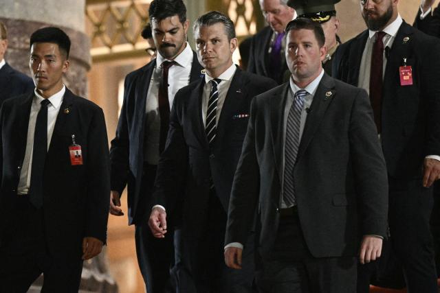 US Secretary of Defence Pete Hegseth (C) leaves after a state banquet for US President Donald Trump and China's President Xi Jinping at the Great Hall of the People in Beijing on May 14, 2026. (Photo by Brendan SMIALOWSKI / AFP)