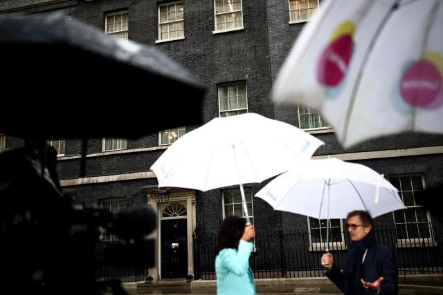 Members of the media stand outside 10 Downing Street in central London on May 14, 2026. Britain's Health Secretary Wes Streeting, possible rival to Britain's Prime Minister Keir Starmer, announced his resignation on May 14, 2026. (Photo by Henry NICHOLLS / AFP)