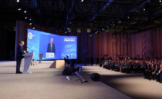 In this pool photograph distributed by the Russian state agency Sputnik, Russia's President Vladimir Putin attends the 10th Congress of the Union of Machine Builders in Moscow on May 14, 2026. (Photo by Vyacheslav PROKOFYEV / POOL / AFP)