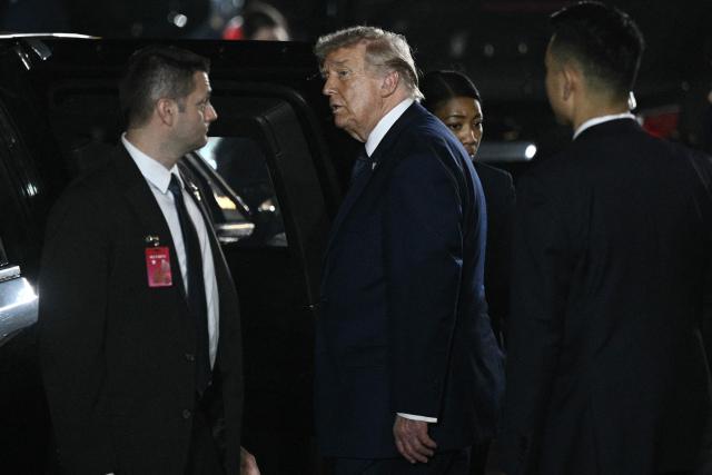 US President Donald Trump (2nd-L) leaves after a state banquet with China's President Xi Jinping at the Great Hall of the People in Beijing on May 14, 2026. (Photo by Brendan SMIALOWSKI / AFP)