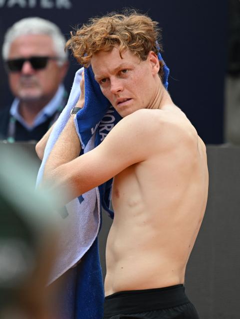 Italy's Jannik Sinner wipes his face after winning against Russia's Andrey Rublev during the ATP Rome Open tennis tournament at Foro Italico in Rome on May 14, 2026. (Photo by Tiziana FABI / AFP)