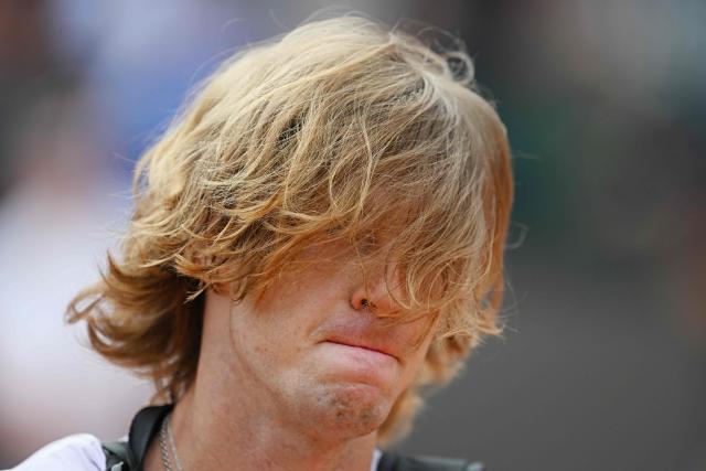 Russia's Andrey Rublev leaves the central court at the end of the match against Italy's Jannik Sinner in their ATP Rome Open tennis tournament at Foro Italico in Rome on May 14, 2026. (Photo by Tiziana FABI / AFP)
