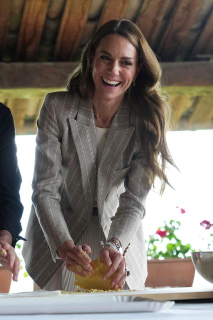 Britain's Kate, Princess of Wales prepares tortelli during her visit to the rural resort ‘Al Vigneto’, part of a two-day trip, in Reggio Emilia, on May 14, 2026. (Photo by Antonio Calanni / POOL / AFP)