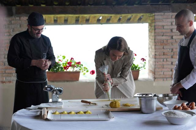 Britain's Kate, Princess of Wales prepares tortelli during her visit to the rural resort ‘Al Vigneto’, part of a two-day trip, in Reggio Emilia, on May 14, 2026. (Photo by Antonio Calanni / POOL / AFP)