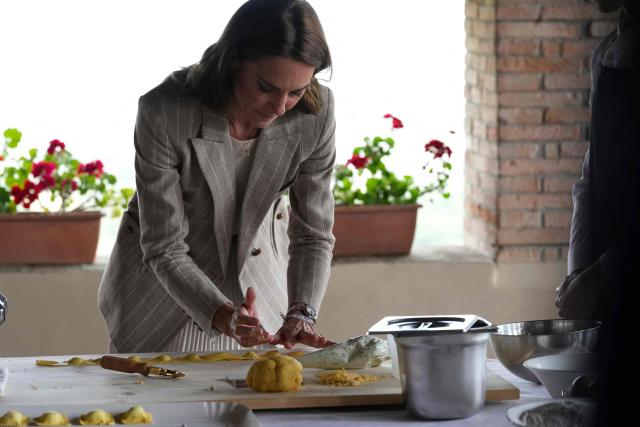 Britain's Kate, Princess of Wales prepares tortelli during her visit to the rural resort ‘Al Vigneto’, part of a two-day trip, in Reggio Emilia, on May 14, 2026. (Photo by Antonio Calanni / POOL / AFP)
