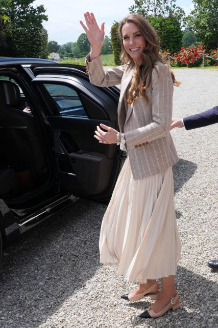 Britain's Kate, Princess of Wales leaves after her visit to the rural resort ‘Al Vigneto’, part of a two-day trip, in Reggio Emilia, on May 14, 2026. (Photo by Antonio Calanni / POOL / AFP)