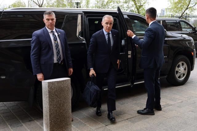 Canadian Prime Minister Mark Carney arrives on Parliament Hill in Ottawa, Canada, on May 14, 2026. Carney is scheduled to speak later this morning on clean energy initiatives. (Photo by Dave Chan / AFP)