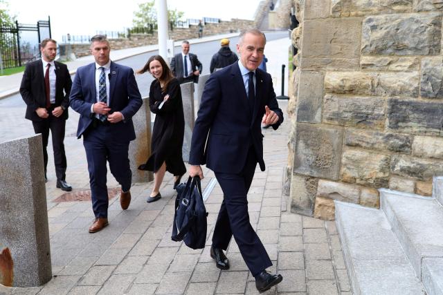 Canadian Prime Minister Mark Carney arrives on Parliament Hill in Ottawa, Canada, on May 14, 2026. Carney is scheduled to speak later this morning on clean energy initiatives. (Photo by Dave Chan / AFP)