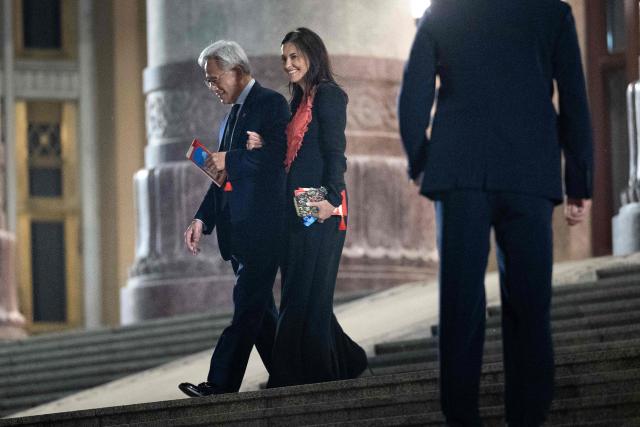 CEO of nvidia Jensen Huang (L) and Egyptian-US financial executive and President at Meta Dina Powell McCormick leave after a banquet with China's President Xi Jinping and US President Donald J. Trump at the Great Hall of the People  in Beijing on May 14, 2026. (Photo by Brendan Smialowski / AFP)