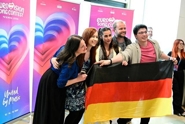 Germany's Sarah Engels (C) poses with fans during a Meet and Greet on the sidelines of the Eurovision Song Contest 2026 (ESC) at the fan village in Vienna, Austria on May 14, 2026, before the second semi-final of the contest. (Photo by Tobias SCHWARZ / AFP)