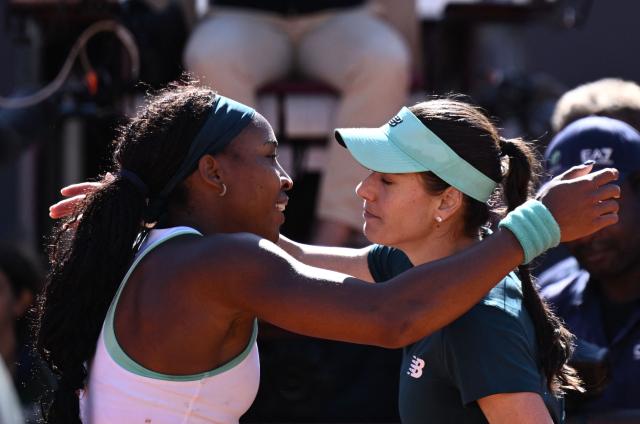 USA's Coco Gauff (L) embraces Romania's Sorana Cirstea at the end of the match during the ATP Rome Open tennis tournament at Foro Italico in Rome on May 14, 2026. (Photo by Tiziana FABI / AFP)
