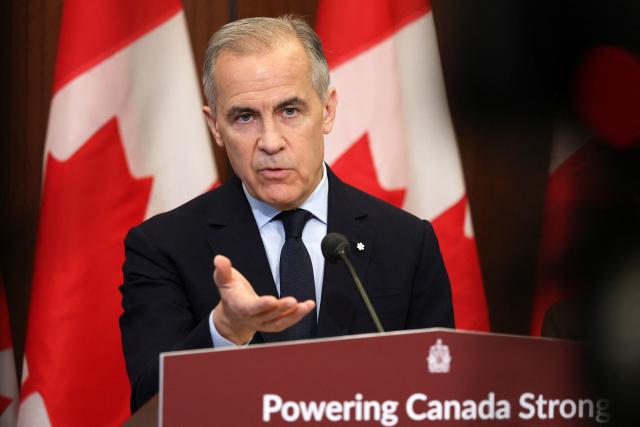 Canadian Prime Minister Mark Carney speaks during a news conference on Parliament Hill in Ottawa, Canada, on May 14, 2026. Carney announced a new agenda on clean energy initiatives. (Photo by Dave Chan / AFP)