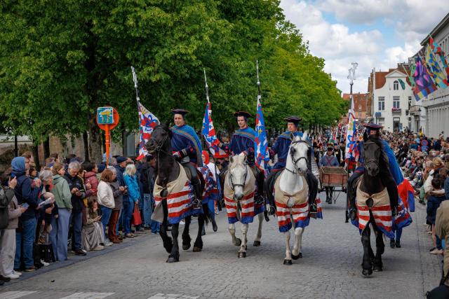 Participants take part in the Procession of the Holy Blood (Heilig Bloedprocessie) through the historic city centre of Bruges on May 14, 2026. The procession, created in 1304 as an expression of gratitude and faith, is held every year on Ascension Day and carries the relic of the Holy Blood through the streets of Bruges. (Photo by KURT DESPLENTER / Belga / AFP) / Belgium OUT