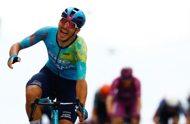 XDS Astana Team Italian rider Davide Ballerini celebrates as he crosses the finish line to win in the 6th stage of the Giro d'Italia 2026 - Tour of Italy cycling race between Paestum and Naples, southern Italy on May 14, 2026. (Photo by Luca Bettini / AFP)